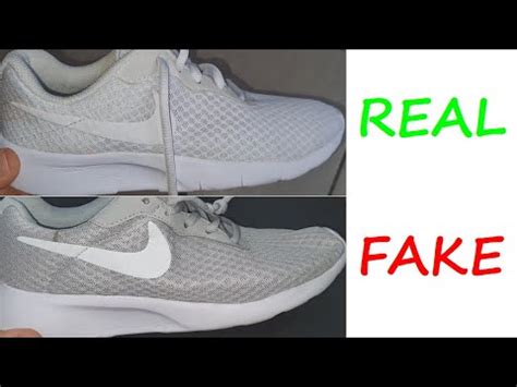 nike tanjun fake vs real|are real nikes real.